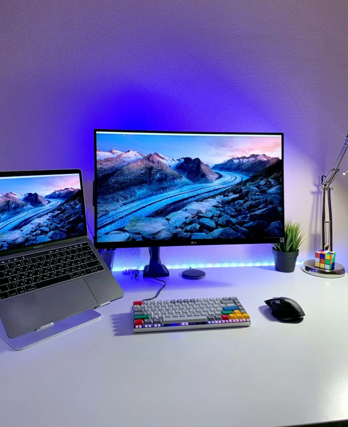 macbook pro beside black computer mouse and black computer keyboard